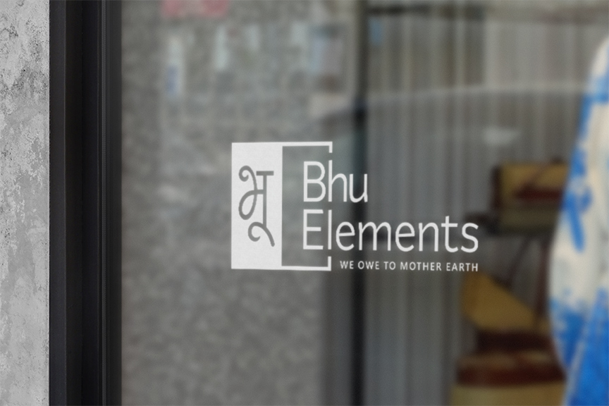 Bhu Elements logo design on glass door signage by First Branding Agency